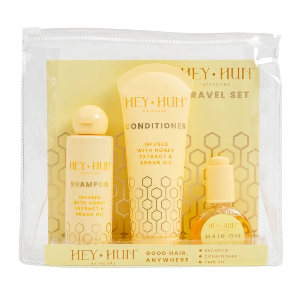 Hey Hun Haircare travel set with shampoo, conditioner and hair oil in a clear zip pouch